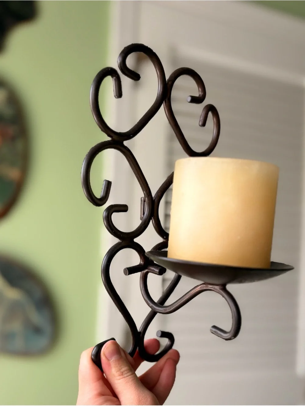 Vintage Metal Scroll Wall Candle Sconce with Cream Pillar Candle